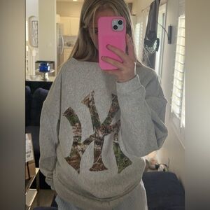 hand sewn grey women's crewneck with NY logo in camo